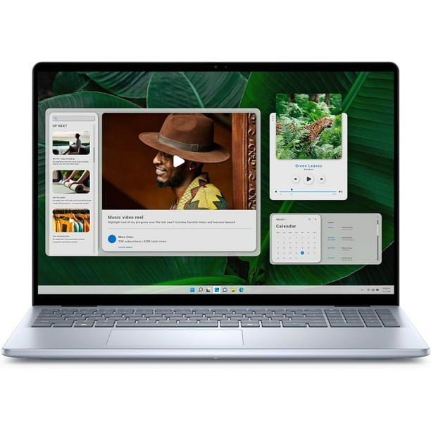 Dell Inspiron 5640 laptop with a 16-inch FHD+ touchscreen display, shown open and powered on. Features include 1TB SSD storage, 32GB RAM, and an Intel Core 7 150U processor. The screen displays a vibrant interface with widgets and applications. The laptop is in open box condition, with no signs of wear and includes accessories like a charger and manuals.