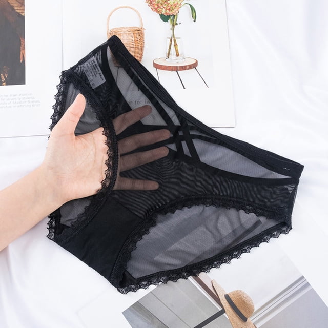 willbest calzon mujer gluteos mujer ropa interior sexy para mujer braguitas de encaje negro de cintura alta de talla grande para mujer. Vista frontal centrada de braguita negra de cintura alta con paneles semitransparentes de malla, borde de pierna con encaje festoneado, cintura elástica ancha y costura visible en tiro; mano sostiene la prenda sobre fondo blanco con revista. A menudo usada para realzar la silueta bajo ropa ajustada.