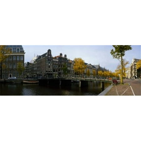 Panoramic Images PPI138796L Buildings along a canal  Amsterdam  Netherlands Poster Print by Panoramic Images - 36 x 12