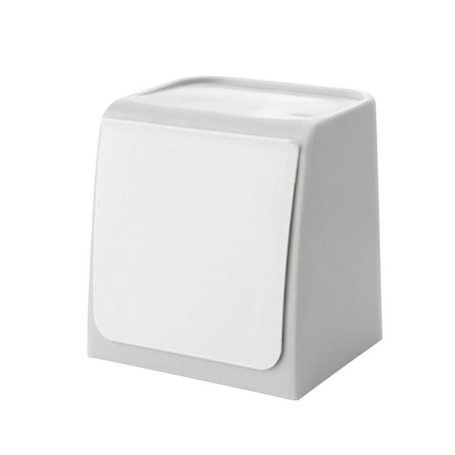 Mini cubo de basura de pared con tapa abatible.