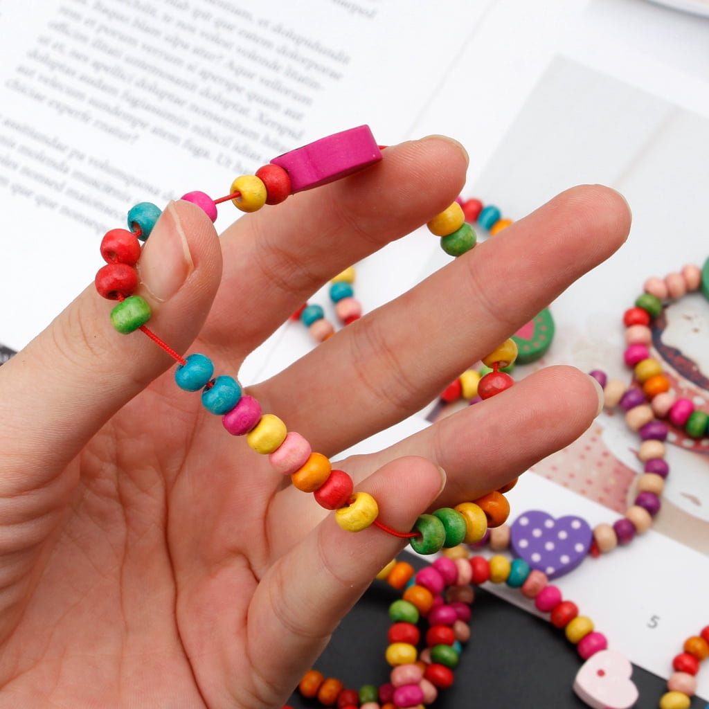 REBECASKYENS Lot De 12 Bracelets En Bois Colorés Pour Filles – Bijoux Enfant élastiques – Cadeau Anniversaire – Motifs Fleurs Cœurs Smileys – Taille Unique