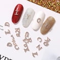 thumbnail image 3 of 10 Uds. De alfabetos para decoración de uñas, brillantes tridimensionales, ahuecados, aleación Diy, 26 letras doradas del alfabeto, diamantes de imitación para salón de uñas, 3 of 5