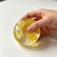 thumbnail image 4 of Lemon Squishy Squeeze Toy, Transparent Plastic Ball With Embedded Slice for Tactile Hand Fidget Play, 4 of 6