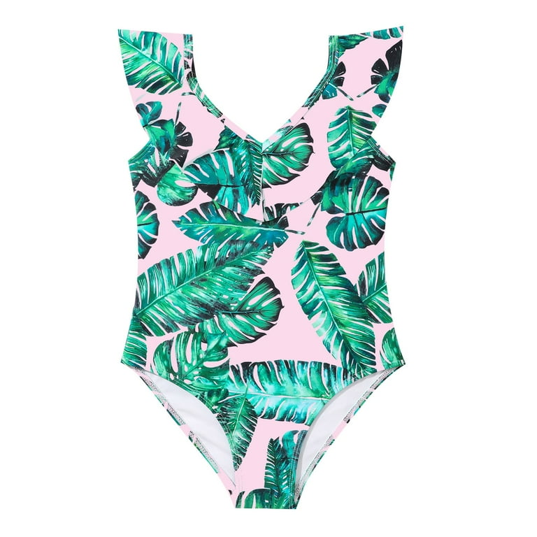 White bathing suit store with green leaves
