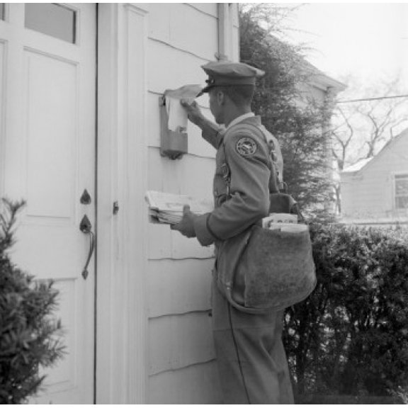 Side profile of a postman dropping mail in a mailbox Canvas Art -  (18 x 24)