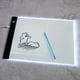 thumbnail image 1 of A5 Ultra-Thin Portable LED Light Box, USB Power Artcraft LED Trace Light Pad For Artists Drawing,Sketching,Diamond Painting, 1 of 4