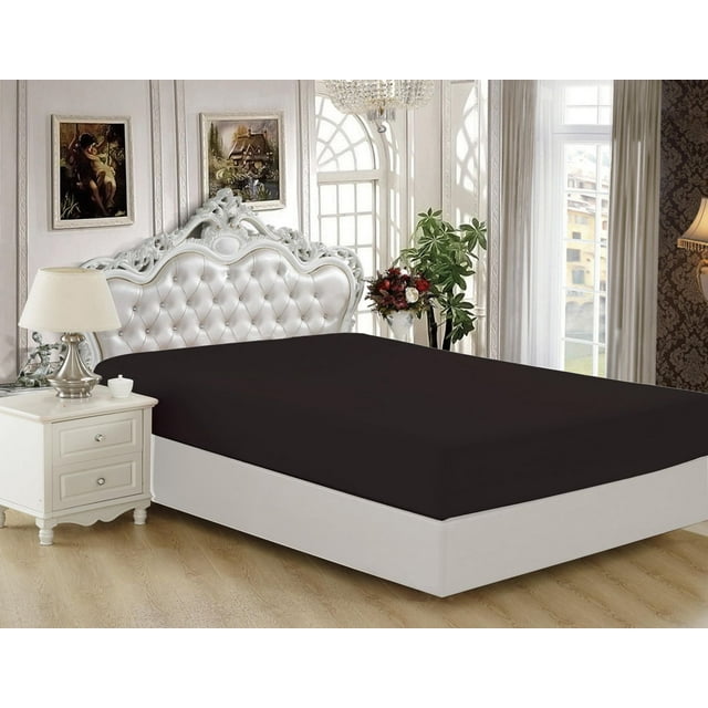 Black Marina Decoration ultra soft silky deep pocket bamboo fitted sheet on white bed with tufted headboard in elegant bedroom.