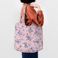 thumbnail image 4 of Xecao's Butterfly Canvas Tote Bag is a versatile choice for women, serving as a stylish beach bag, shopping bag,and reusable grocery bag., 4 of 5