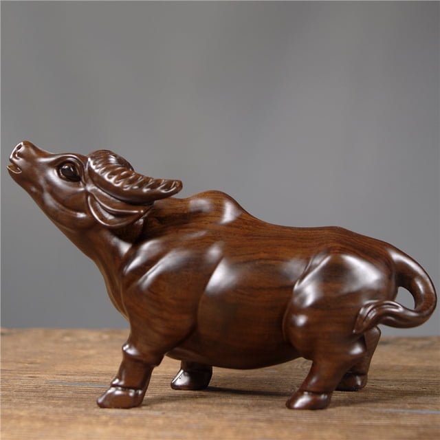 Rosewood carved ox figurine, a feng shui decorative craft for home, living room, or office use.