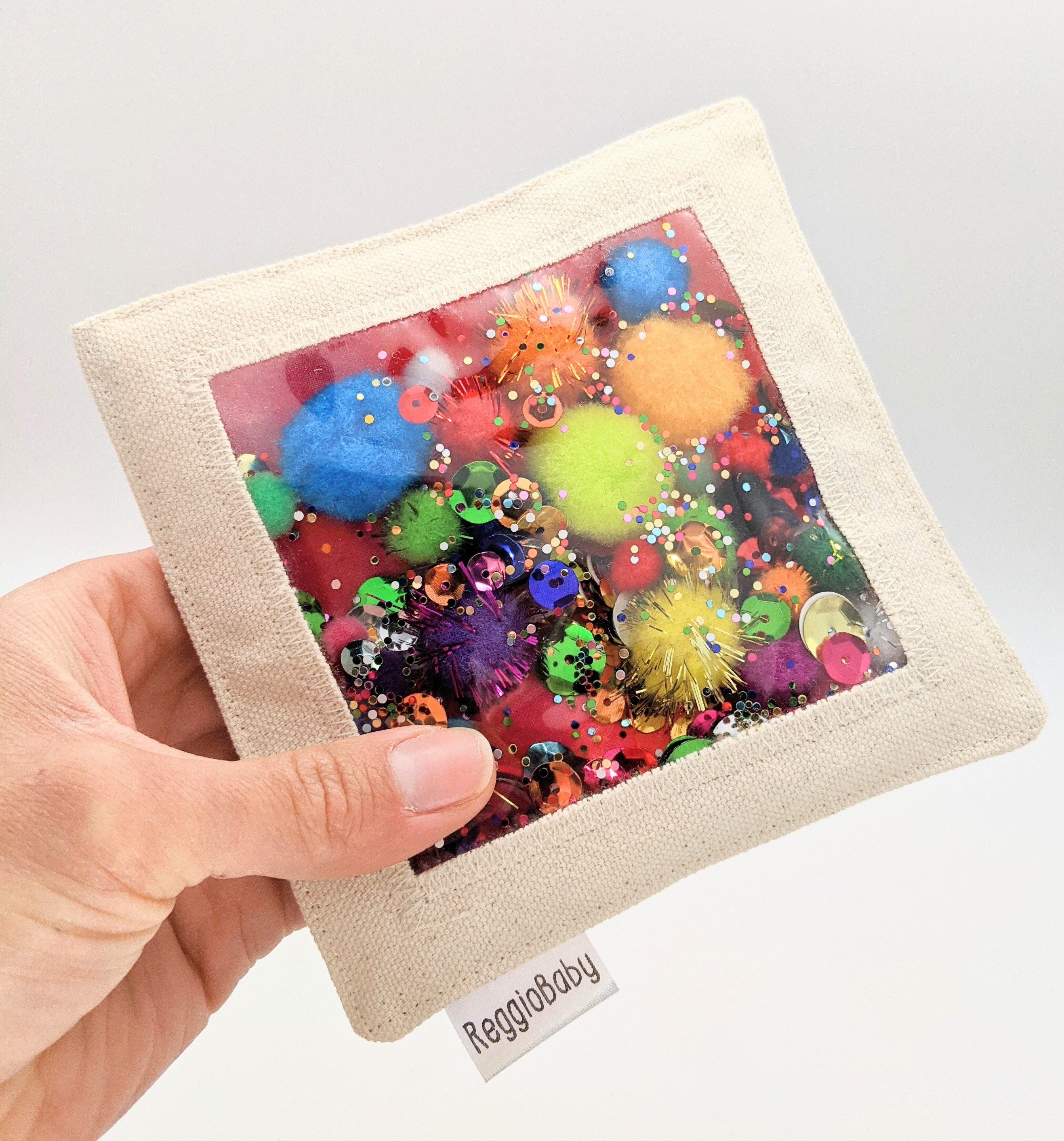 Sensory Toy with Pom Poms and Sequins