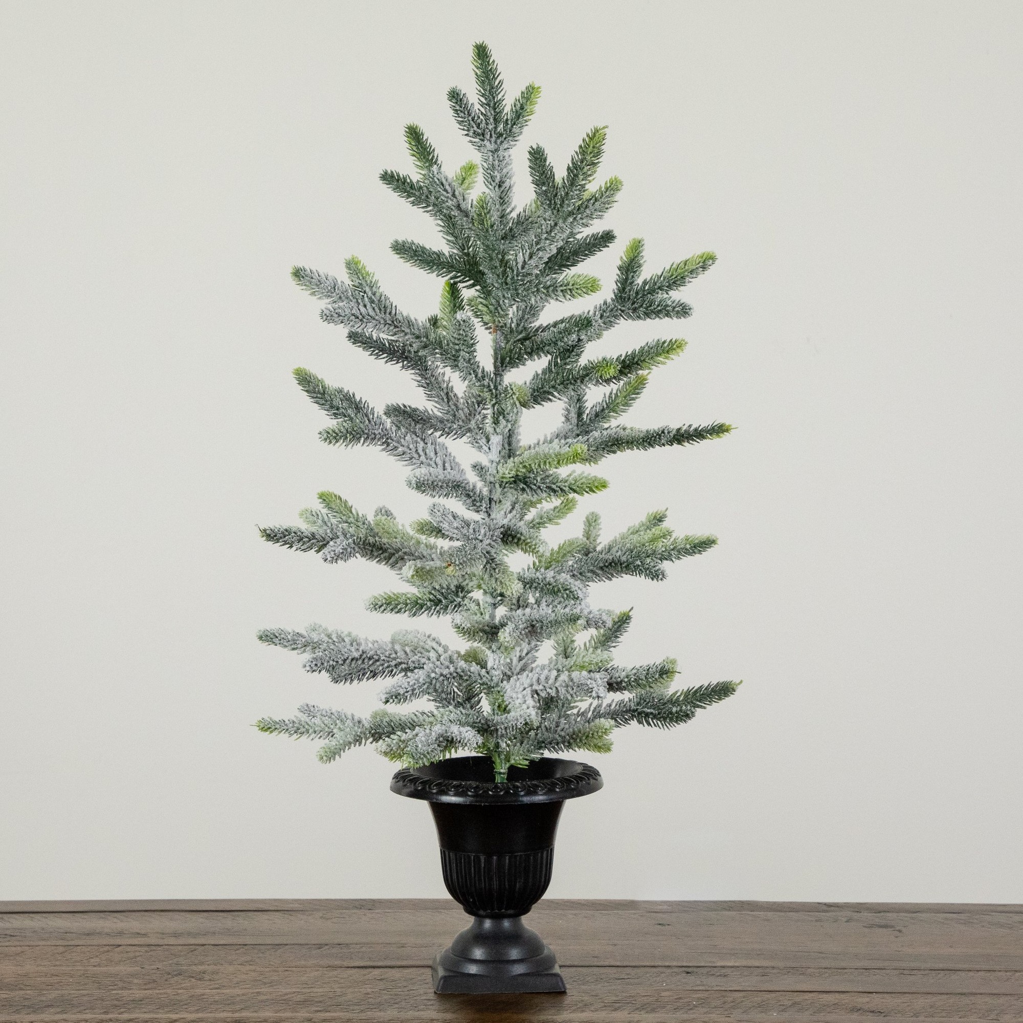 2ft. Artificial Frosted Christmas Tree in Black Decorative Urn