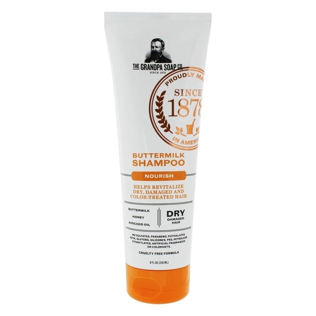 champú de mantequilla abuelo ( 1 x 8 oz ) tubo frontal blanco de 8 oz con tapa naranja, logo Grandpa Soap y sello circular dorado 'Since 1878', texto 'Buttermilk Shampoo' y 'Nourish', lista pequeña de ingredientes y la etiqueta indica ayuda para cabello seco/dañado; también suele usarse para enjuagar accesorios de tela delicada.