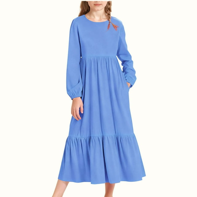 Vestido infantil de poliéster de manga larga, cuello redondo, bolsillos laterales y falda larga.