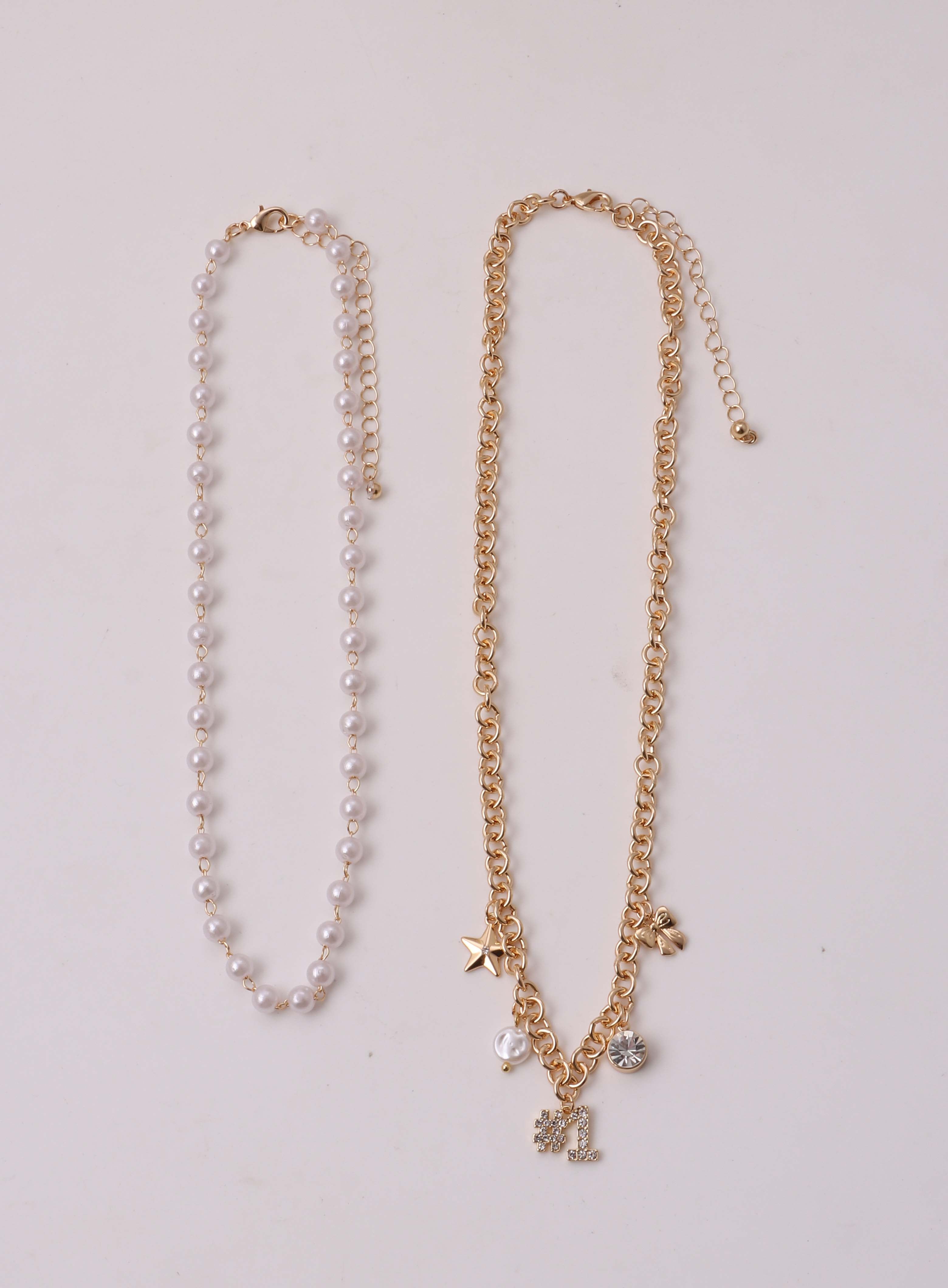 No Boundaries Women's 2 pc Game Day White Beads and Gold Tone Charm Necklace Set With #1, Bow & Star