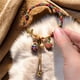 thumbnail image 1 of Wmhnj Pulsera tnica ajustable hecha a mano con cuerda y smbolo mitolgico del pez tragador dorado, ideal como regalo para la transformacin espiritual., 1 of 9
