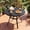 Black - 41.1'', variant on LAZY BUDDY 27.6'' Round Outdoor Table with 1.57'' Umbrella Hole, Patio Dining Table with Adjustable Foot Pads, Outside Bistro Table for Backyard, Lawn, Deck, Poolside