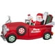 thumbnail image 1 of Papá Noel inflable navideño y la señora Claus en un coche rojo, 1 of 4