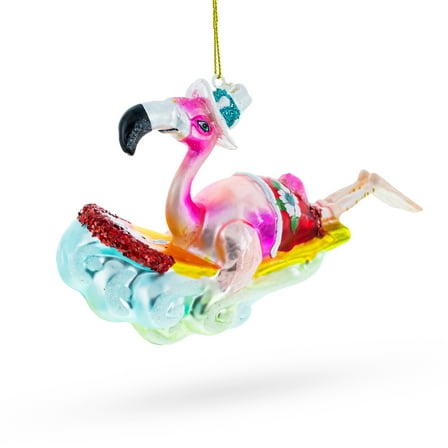 Pink Flamingo Riding a Surf Wave Glass Christmas Ornament