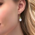thumbnail image 2 of Gem Stone King 18K Rose Gold Plated Silver White Moissanite and Green Peridot Dangle Earrings for Women (6.96 Cttw, Gemstone Birthstone, Oval 10X8MM, Trillion 5MM), 2 of 4