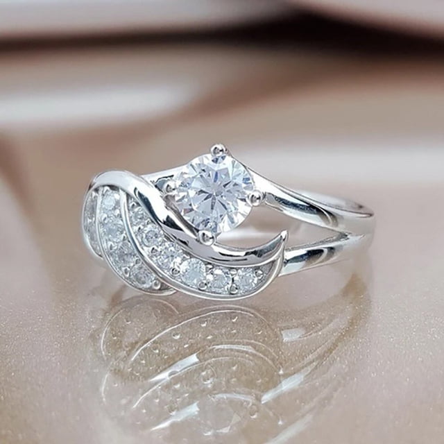 Anillos para mujer, regalos para mujer, exquisito anillo de moda con incrustaciones de plumas de circonita cúbica en el flanco.