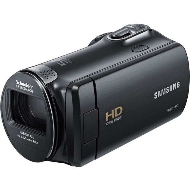samsung videocámara con memoria flash hmx-f80 (negra) (caja abierta) Vista 3/4 frontal de la videocámara HMX-F80 negra con lente Schneider Kreuznach, marcado HD CMOS SENSOR y logo SAMSUNG en el costado, rueda de zoom y botón de grabación en la parte superior y pantalla LCD plegada; grabación HD 1280x720/30p y frecuentemente usada para crear contenido en redes sociales por su tamaño portátil.