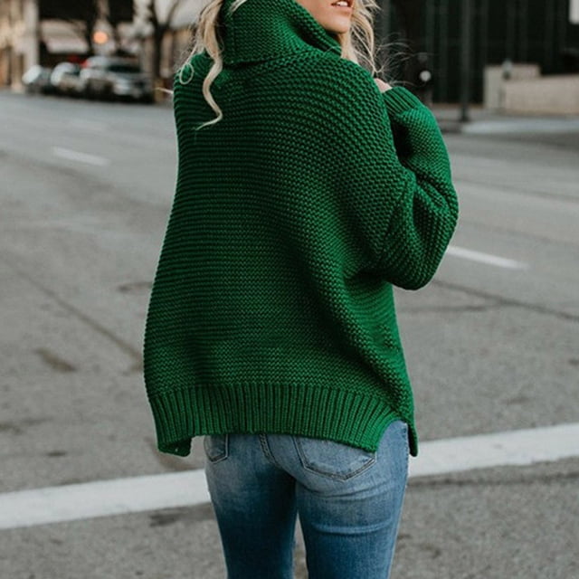 Women's Casualsolid Color Casual Thick Line Long Sleeve Turtleneck Sweater in a vibrant green shade, featuring a textured knit design and a relaxed fit. The sweater has a high turtleneck collar and long sleeves, making it ideal for autumn and winter wear. Shown styled with blue jeans in an outdoor urban setting.