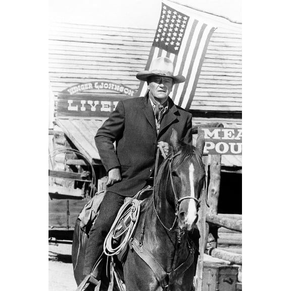 John Wayne in Chisum iconic on horseback American flag flying behind him 24x36 Poster