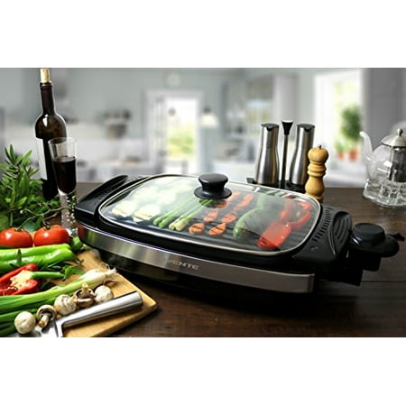 - Ovente Reversible Electric Grill and Heat Tempered Glass Cover with Bonus Non Stick Skillet, Indoor and Outdoor Grilling, 1800 Watts, Black (GR3002B)