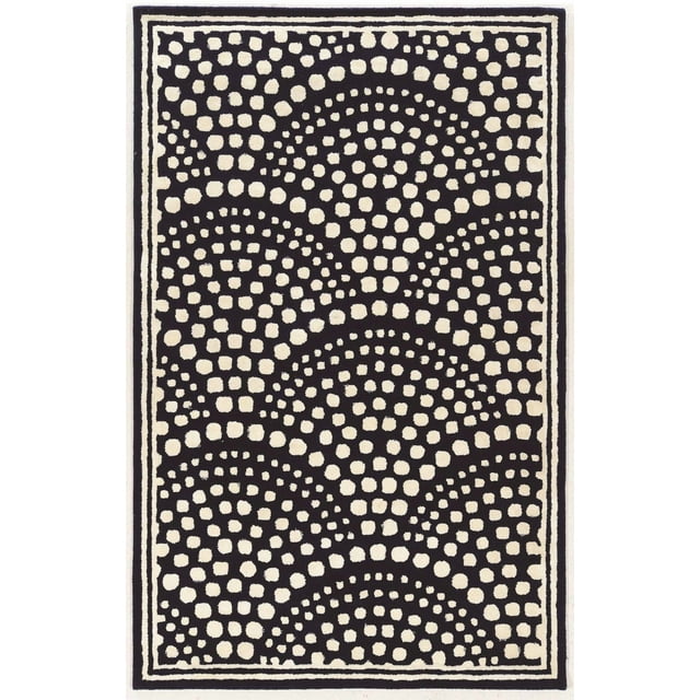 Aspire wool area rug in navy and white featuring a scallop design created by clusters of different sized dots, measuring 8 feet by 11 feet.