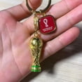 thumbnail image 3 of 2 llaveros con trofeo 3D de la Copa Mundial de la FIFA 2022: posee una versión coleccionable del premio de fútbol más grande del mundo, recuerdos de la Copa del Mundo Rojo Verde, 3 of 5