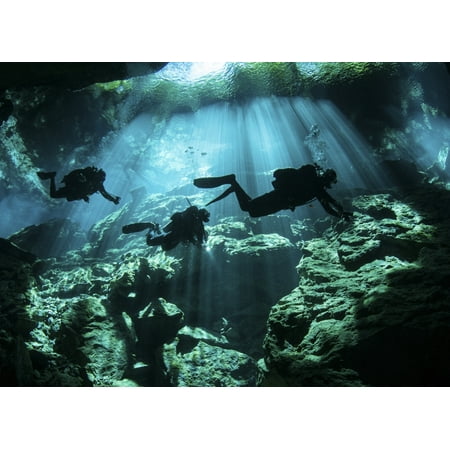 Diver enters the cavern system in the Riviera Maya area of Mexico Stretched Canvas - Karen DoodyStocktrek Images (17 x