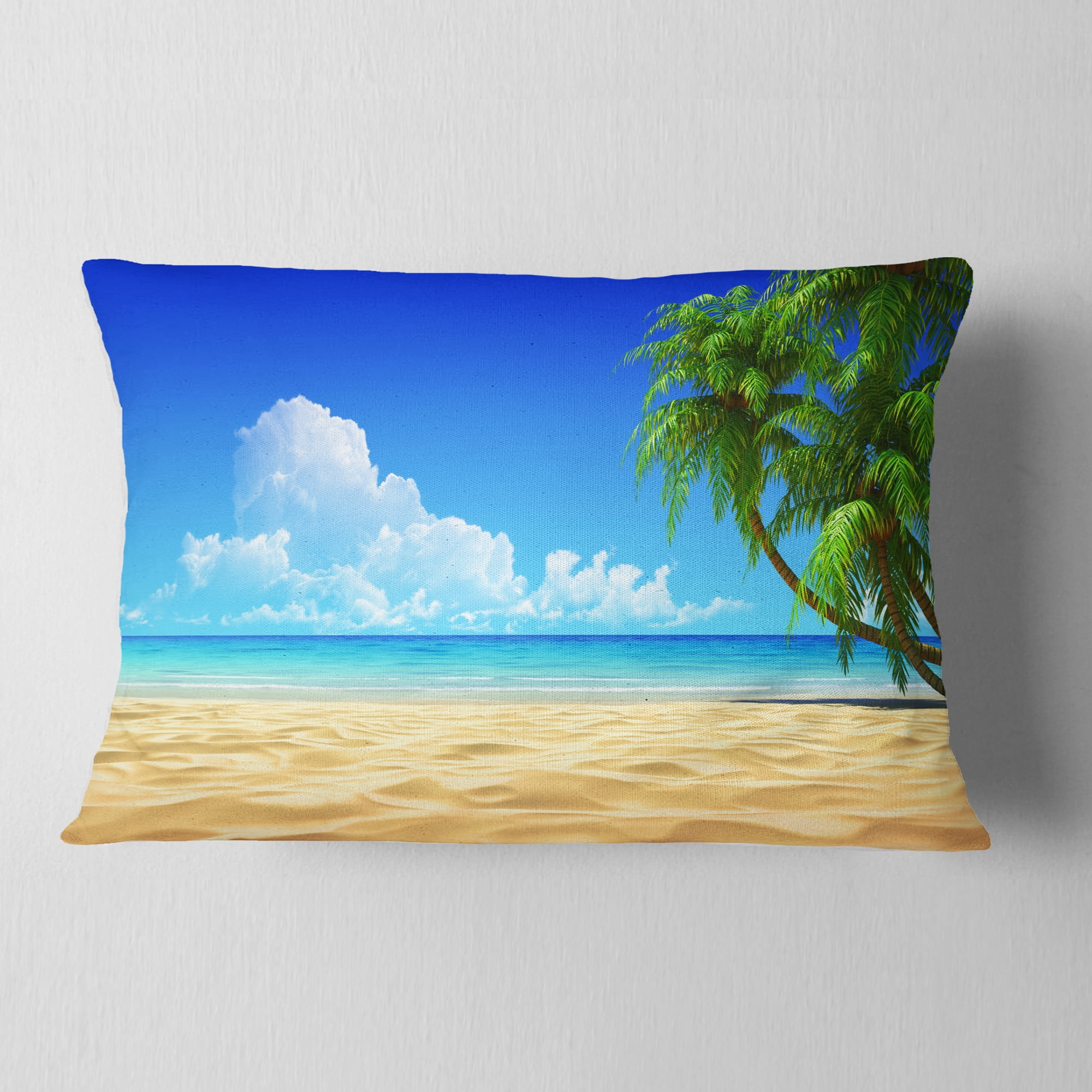 Designart Coconut Palms Bent into Beach - Seashore Throw Pillow - 12x20