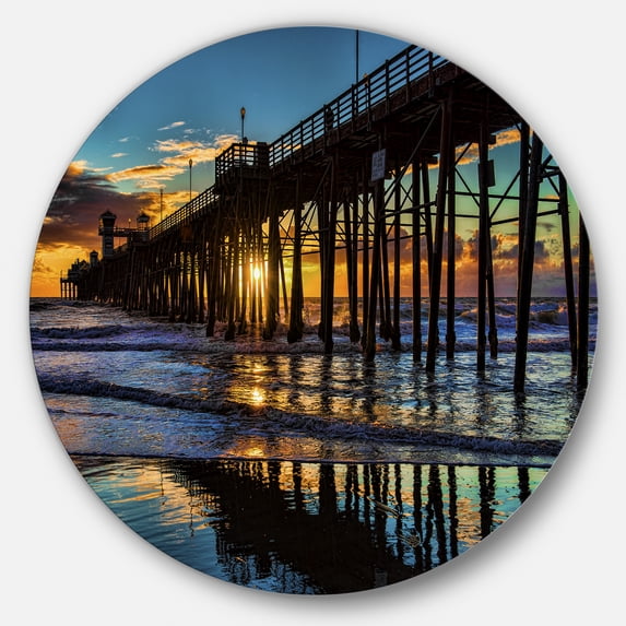 Designart 'Oceanside Pier at Evening' Landscape Photography Circle Metal Wall Art