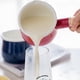 thumbnail image 4 of Cacerola para leche esmaltada, mini cacerola esmaltada con calentador de mantequilla y utensilios de cocina pequeños, con mangos de madera, muy adecuada para calentar líquidos más pequeños, 4 of 7