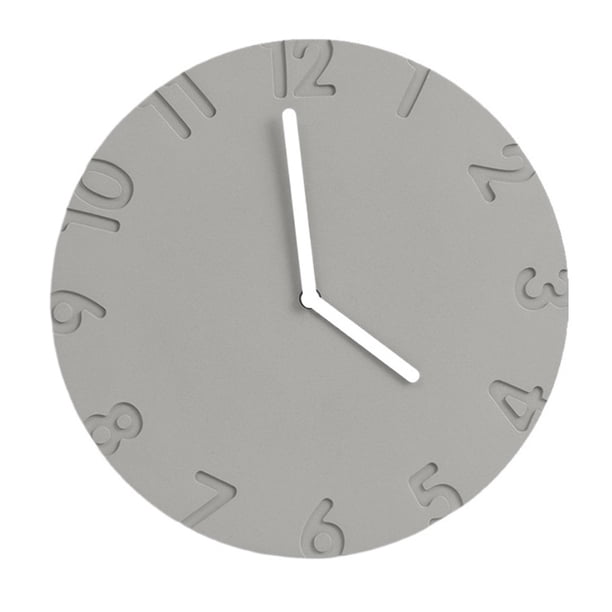 Reloj de pared redondo. Diseño moderno y minimalista. Funcionamiento silencioso. Alimentado por pilas.