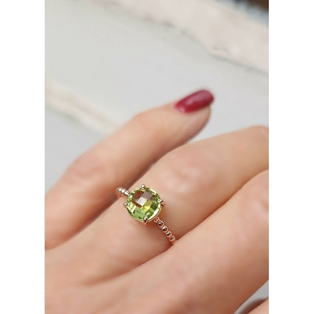 Solitaire ring, silver, rose gold and round peridot, briolette cut