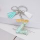 thumbnail image 2 of Llavero de letras con borlas verdes | Colgante de cristal acrílico | Lámina de oro, pegamento en gota, joyería de piedra engrosada | Amuleto de bolso con estilo, accesorio para mochila | 1 pieza, 2 of 2