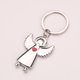 thumbnail image 2 of Llavero con forma de ángel plateado con detalle de corazón rojo, 3 x 6 cm, 2 of 3