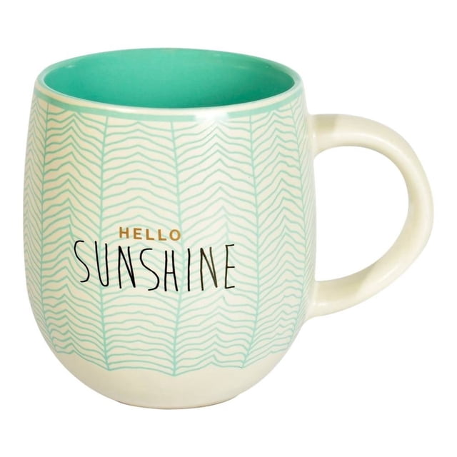 taza hometrends hello sunshine 460 ml Multicolor mug de cerámica, vista frontal con silueta redondeada, texto 'HELLO SUNSHINE' en negro y naranja sobre fondo crema con patrón de hojas onduladas en verde menta, interior esmaltado verde menta y asa curva; ideal para bebidas calientes y fácil de limpiar.