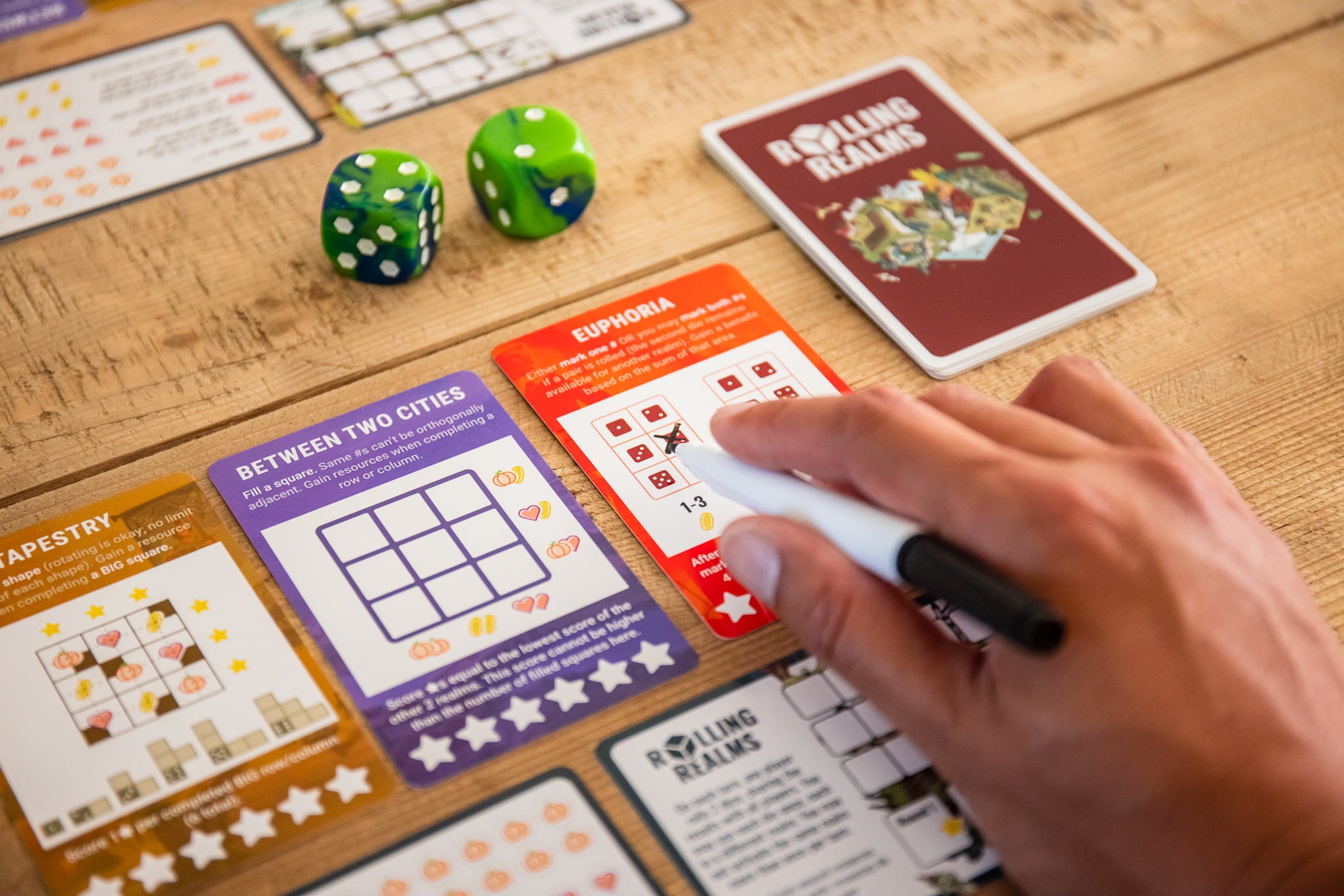 Rolling Realms by Jamey Stegmaier - A Roll-and-Write Strategy Board Game from Stonemaier Games