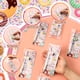 thumbnail image 4 of Set de 12 juegos de bolígrafos con forma de donut de Sayglossy para regalo con adornos, 4 of 6
