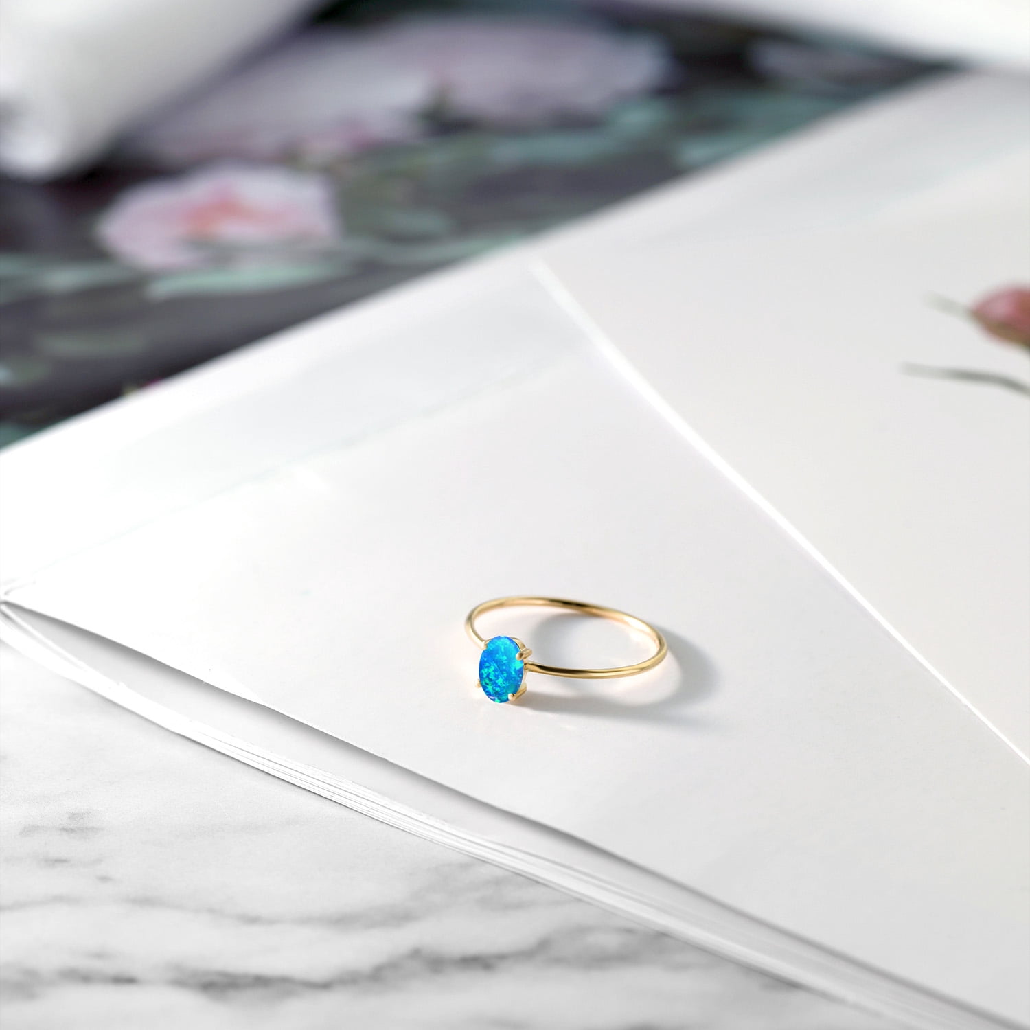 Gem Stone King 10K Yellow Gold Blue Simulated Opal Women Engagement Ring (0.50 Ct Oval Cabochon Cut 6X4MM,)