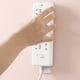 thumbnail image 3 of Soporte montado en la pared, fijador de enchufe sin perforaciones, fijador de enchufe autoadhesivo, tira de alimentación sin costuras, organizador de cables para el hogar, bastidores, 3 of 4