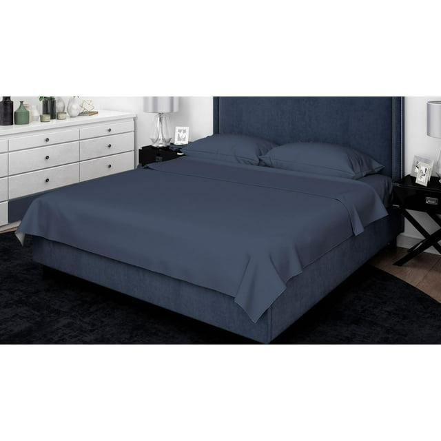 King size bed dressed with navy blue Johnson Home 500 Thread Count Liquid Cotton Sheet Set featuring smooth fabric and matching pillowcases in a contemporary bedroom setting.