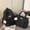 Black headphones, variant on Unique and versatile star-patterned backpack with large capacity for female college students, suitable for travel and graffiti