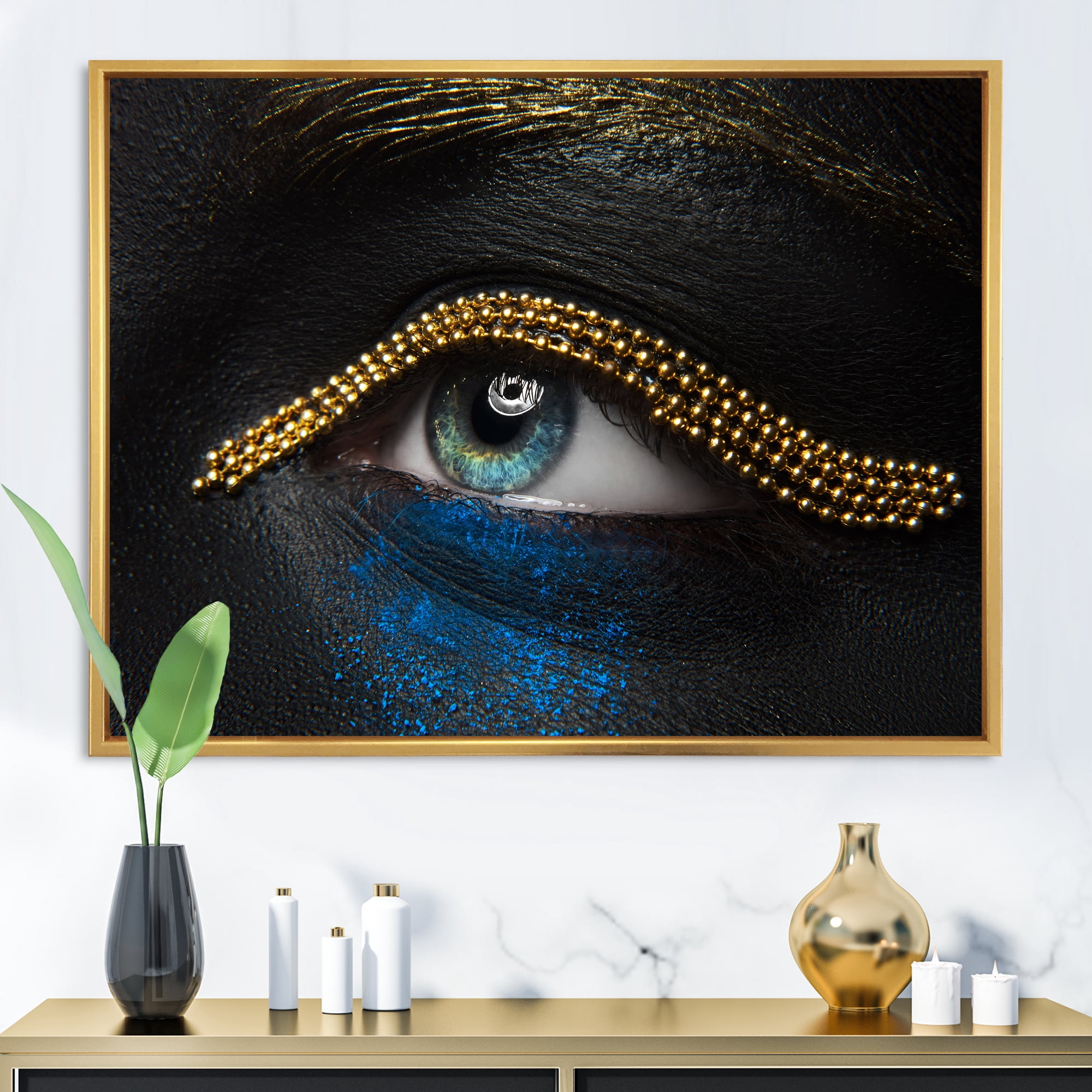 Woman Eyes With Black Skin With A Gold Chain 32 in x 24 in Framed Photography Canvas Art Print, by Designart