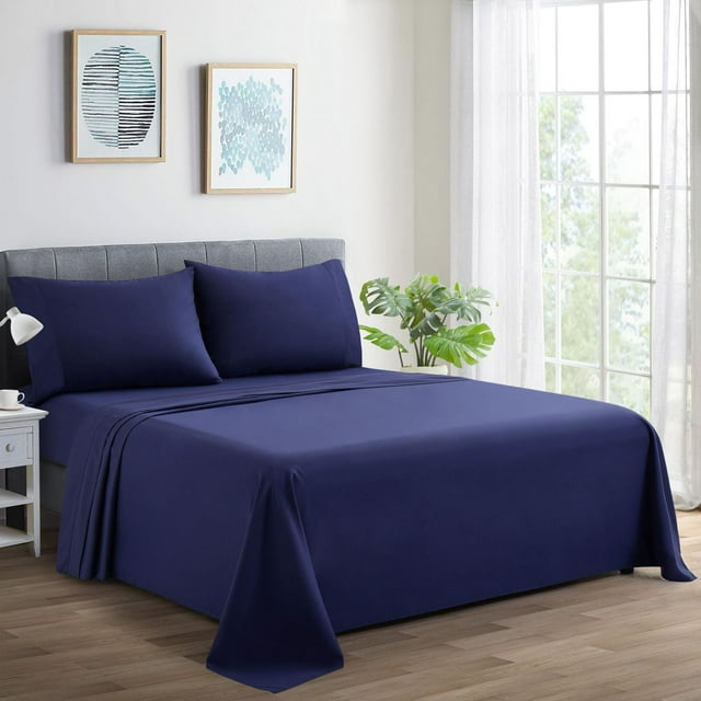 Navy blue Marina Decoration 600 thread count ultra soft deep pocket hotel standard solid bedding sheet set on bed with matching pillowcases in bright room.