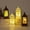 A,B,C,D, variant on KOYPTL 2 Pcs Christmas Snow Globe Lanterns,Glowing Mini LED Lanterns With Santa Snowman Xmas Tree Battery Operated Christmas Hanging Lanterns for Tree Home Decor Outdoor and Indoor Xmas Decor