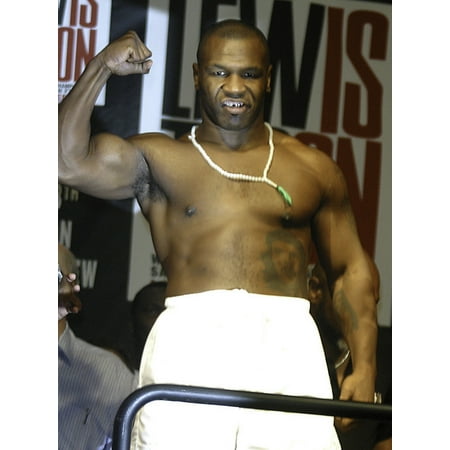 Mike Tyson weighing in before his fight with Lennox Lewis Photo