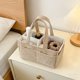 thumbnail image 4 of Organizador portátil para pañales con asa y separadores | Cesta de almacenamiento para artículos de bebé y regalos para baby shower, 4 of 5